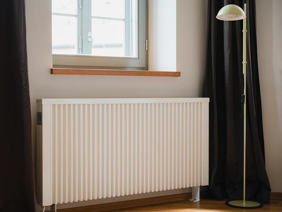 New white panel radiator fitted under a window in a living room